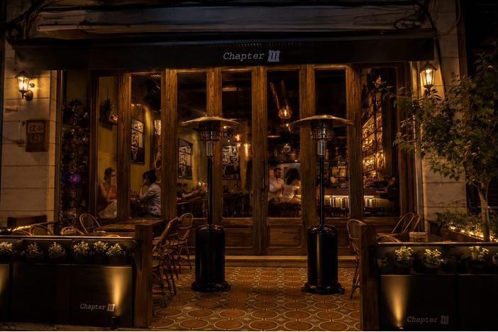 Chapter III bar entrance in Zahlé, glass doors and warm lighting