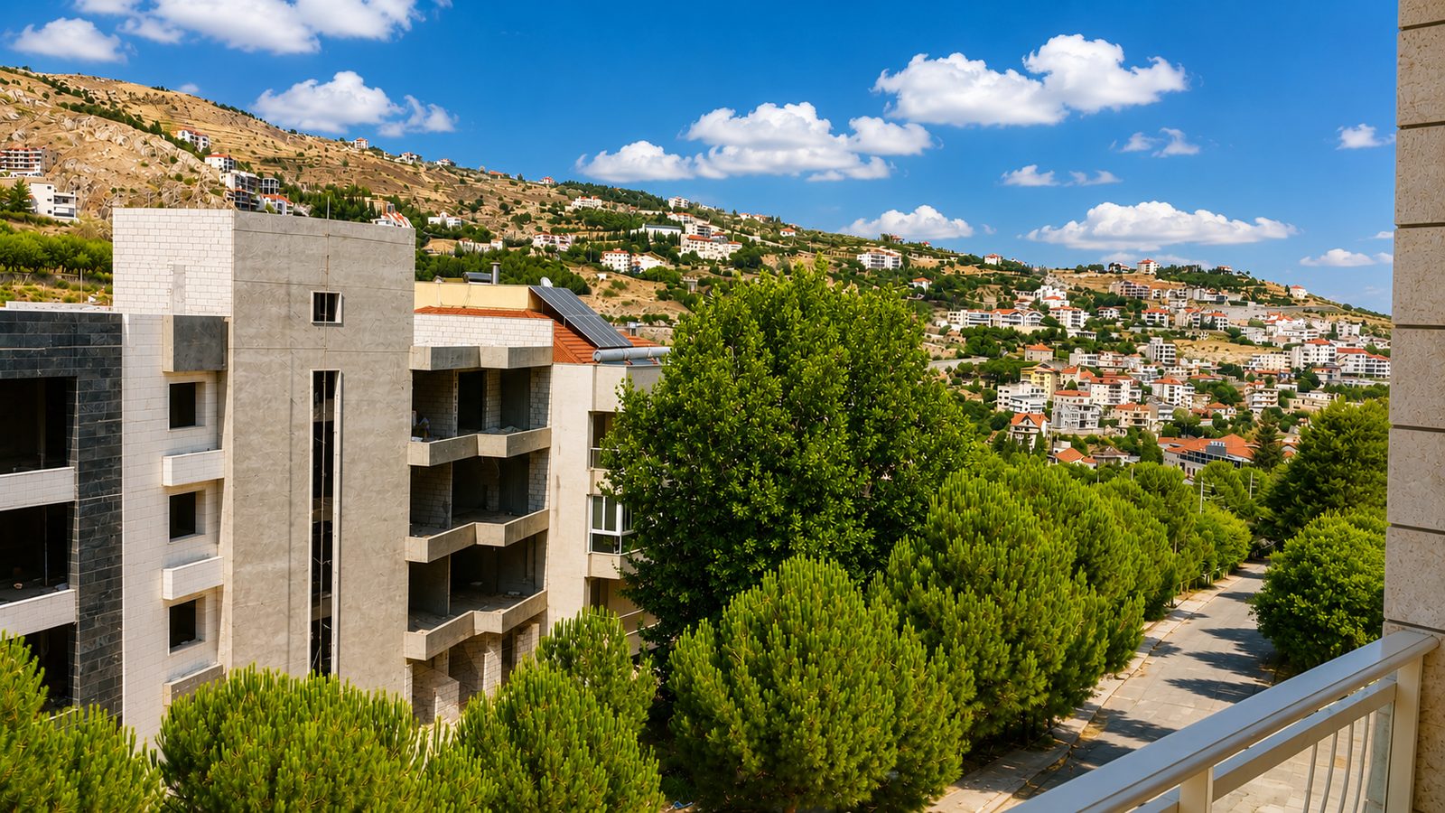 Balcony view from the Berdawny Apartments 2-bedroom unit over the hills and rooftops of Zahlé