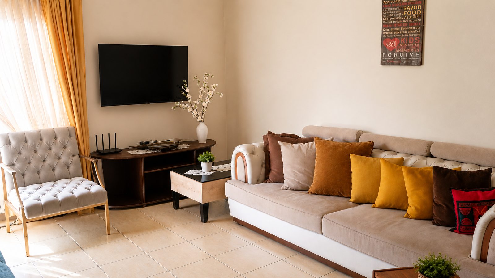 Berdawny Apartments 2-bedroom living room with sofa, armchair and TV